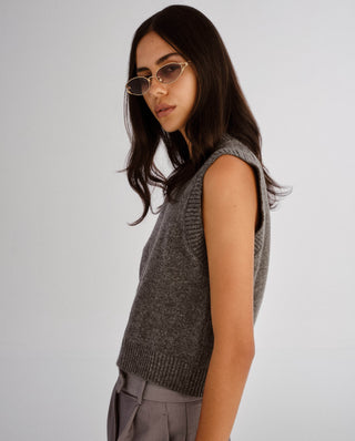 Gold oval frame sunglasses featuring slim split temples and gradient grey lenses.