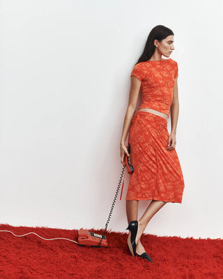 orange midi skirt with floral pattern