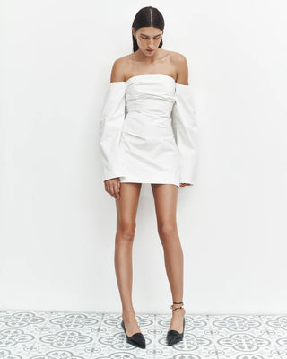 Ivory off shoulder mini dress with structured long sleeves.