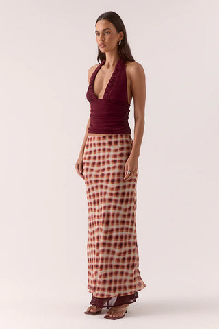 Burgundy halter top with ruched detailing.