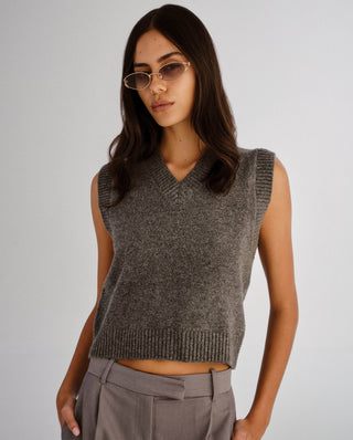 Gold oval frame sunglasses featuring slim split temples and gradient grey lenses.