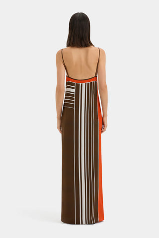 Brown and orange striped maxi slip dress with thin straps.