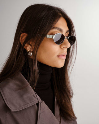 Silver framed sunglasses with dark lenses
