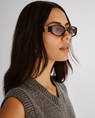 Tortoise oval sunglasses with gradient lenses.