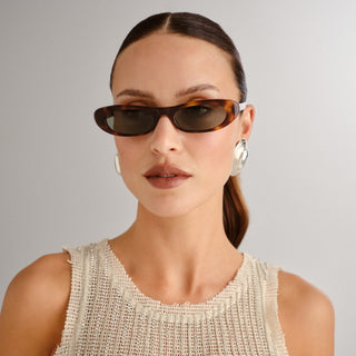 Saint Laurent SL557 Shade sunglasses. TORTOISESHELL SUNGLASSES WITH NYLON LENSES AND NARROW ELONGATED CAT-EYE FRAMES IN ACETATE.