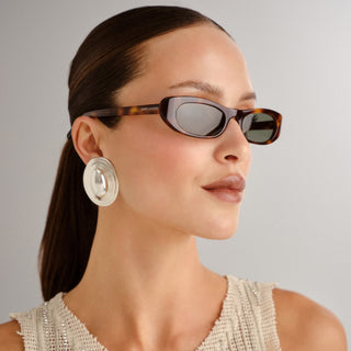 Saint Laurent SL557 Shade sunglasses. TORTOISESHELL SUNGLASSES WITH NYLON LENSES AND NARROW ELONGATED CAT-EYE FRAMES IN ACETATE.